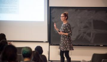 A teacher presenting a lecture to her class