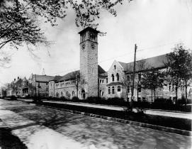 An old photo of Queen's University campus, featuring Kingston Hall